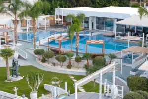 White Luxury Villa  with a sauna room, wine cellar, gym, and the biggest lake pool you will see.