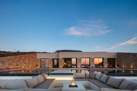  villa exterior and firepit at sunset