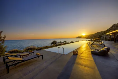  Pool water reflecting sunset sky