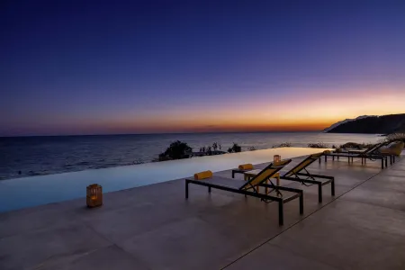  Sun loungers beside pool during golden hour