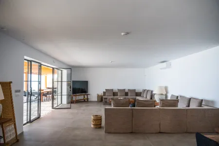  Living room with sofa and pool view