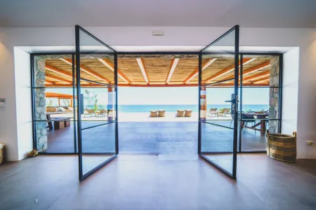  Large living room window with sea and pool view