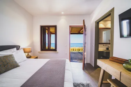 Bedroom with door overlooking the sea and ensuite