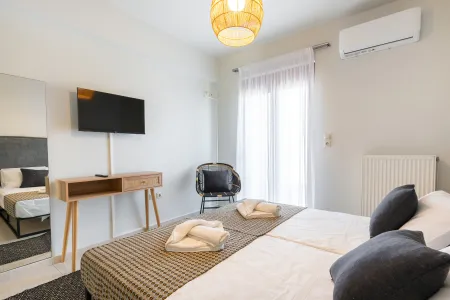   twin bedroom with tv