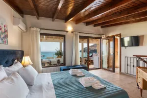 Beachfront Villa Penelope Home with Hot Tub, Walking Distance to everything in Panormo, Crete