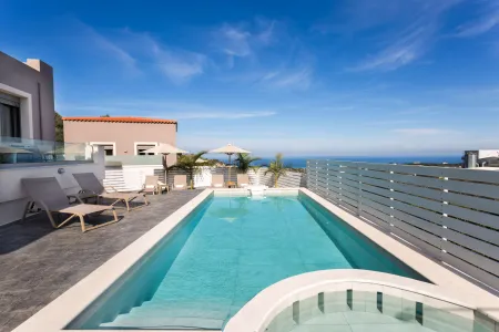  Pool area with sunbeds and sea view