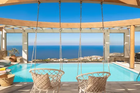  swimming pool and hanging chairs